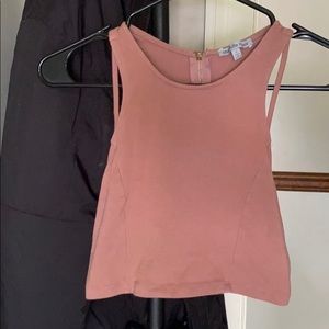 Nude/pinkish crop top.